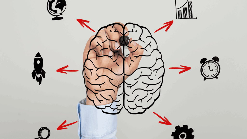 Hand drawing a brain with arrows pointing to icons, symbolizing mindset mastery and brain potential



