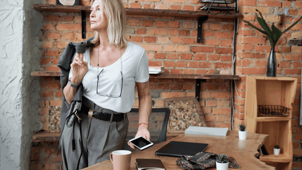 Beyond the Paycheck: How a Purpose-Driven Career Change Can Transform Your Life 2 Confident professional woman reflecting the outcomes of a purpose-driven career change.