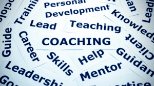 Coaching concept with words like skills, guidance, mentor, and leadership displayed on paper strips for anxious depression support.