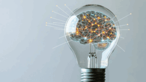Brain illustration glowing inside a lightbulb, symbolizing innovation and Brain-Based Learning strategies.