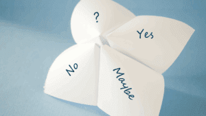 The Dopamine Paradox: Wanting vs. Liking Explained 1 Paper fortune teller showing “Yes,” “No,” “Maybe,” and “?” options, symbolizing the dopamine paradox of uncertain rewards.
