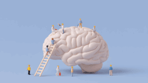 The Neuroscience of Micro-Changes: How Tiny Steps Transform Everything 1 Miniature workers building a human brain model, symbolizing the neuroscience of micro-changes in personal growth.