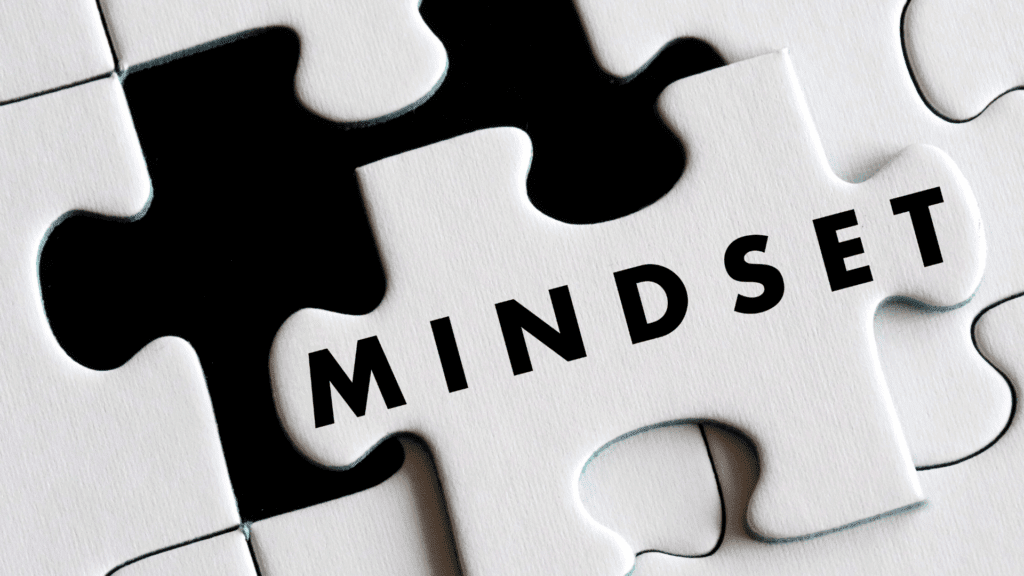 Neuroscience Based Mindset Coaching for Peak Performance 2 White puzzle piece with MINDSET text fitting into black puzzle background representing neuroscience based mindset coaching integration