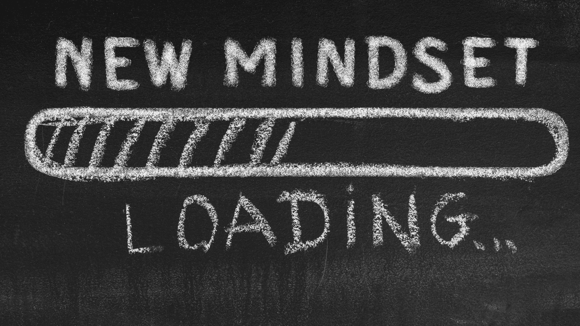 Chalk drawing on blackboard showing NEW MINDSET loading progress bar for neuroscience based mindset coaching transformation