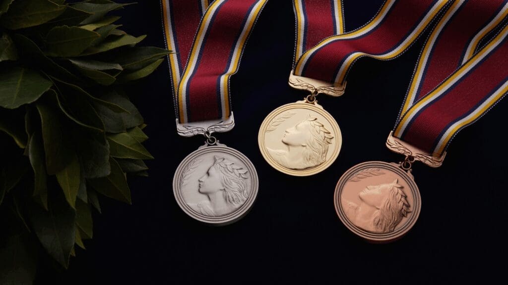 Achievement medals on ribbons representing success after overcoming anxiety and fear for high performers
