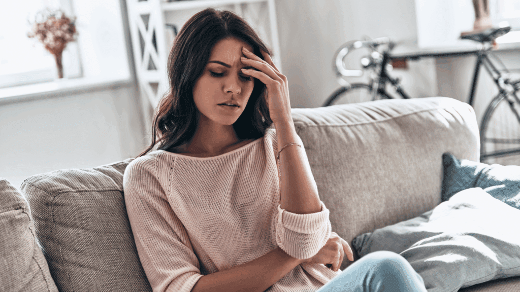 Feeling Blah? Discover the Neuroscience of Joy 1 Woman experiencing emotional numbness and stress while feeling blah, showing the need for neuroscience-based support.