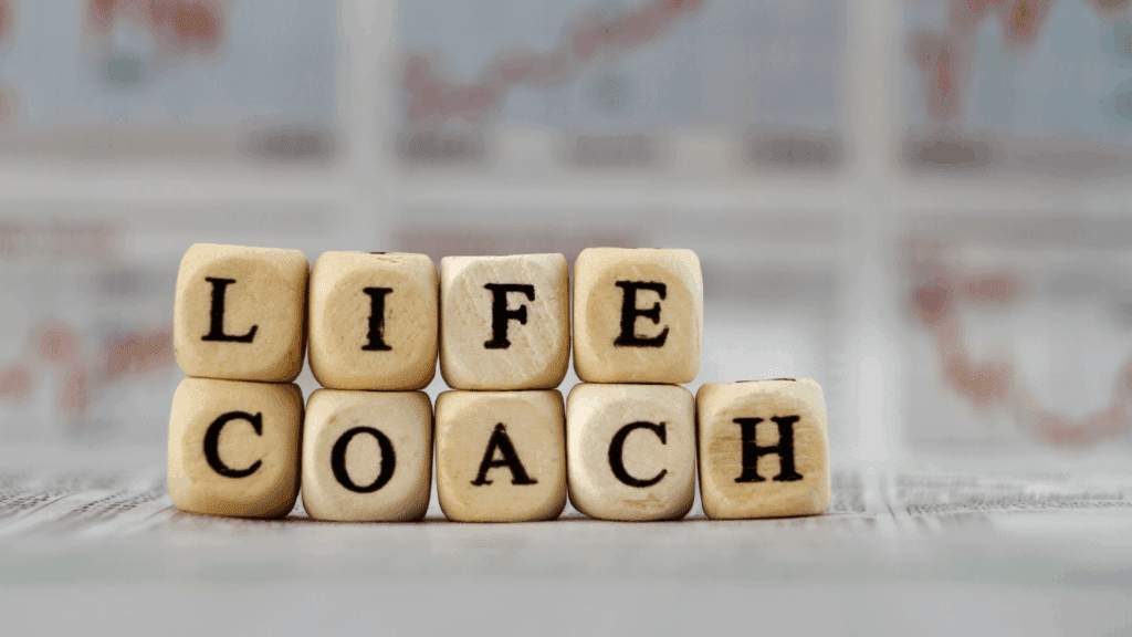 Life Coaching vs Neuroscience Coaching: A Complete Guide 1 Wooden blocks spelling life coach representing traditional life coaching vs neuroscience coaching approaches