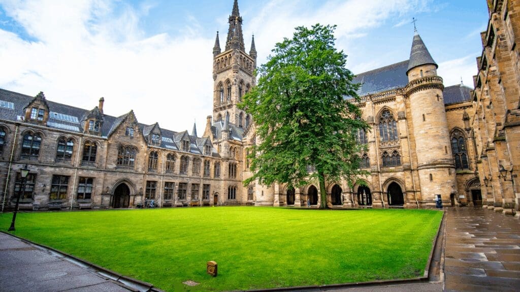 Historic stone university courtyard representing rigorous academic foundation of life coaching vs neuroscience coaching credentials