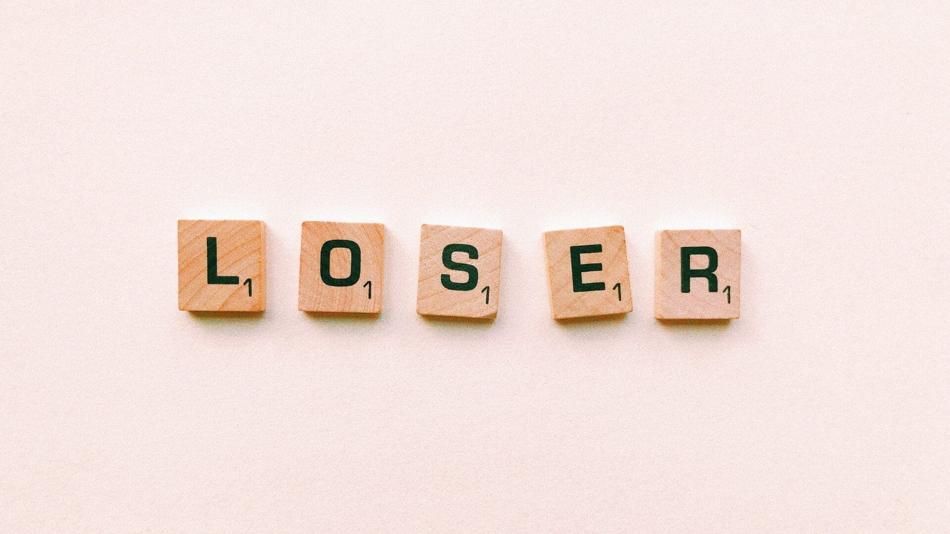 Scrabble tiles spelling loser, representing the inner dialogue of asking, am I a loser.