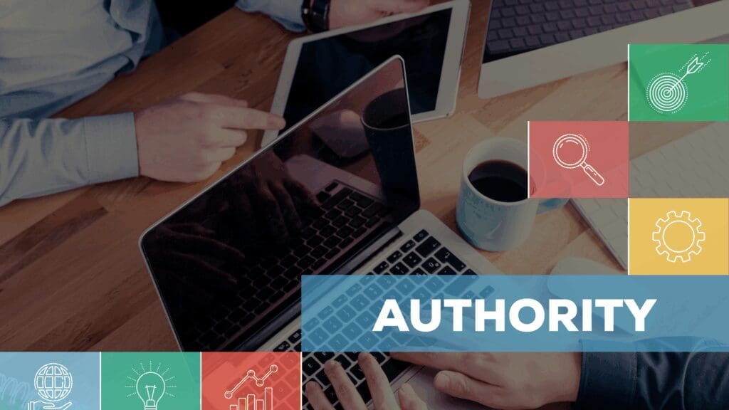 The word “Authority” displayed on a laptop during a strategy meeting about topical authority in neuroscience-based coaching.