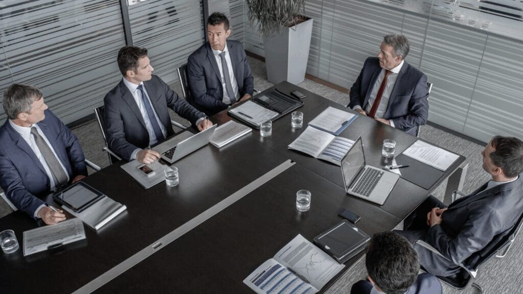 Leadership team meeting applying dopamine workplace performance neuroscience principles.