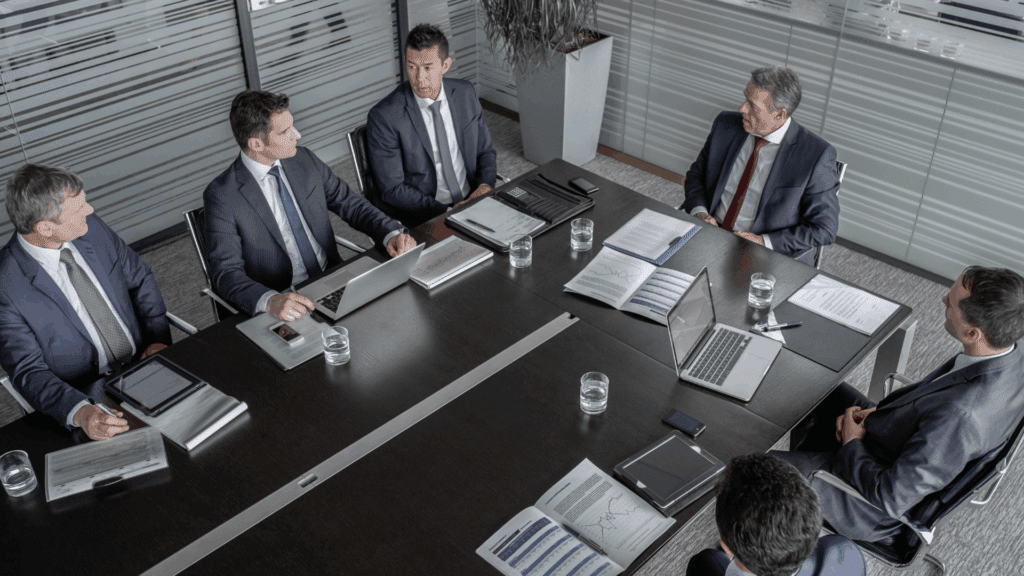 Leadership team meeting applying dopamine workplace performance neuroscience principles.