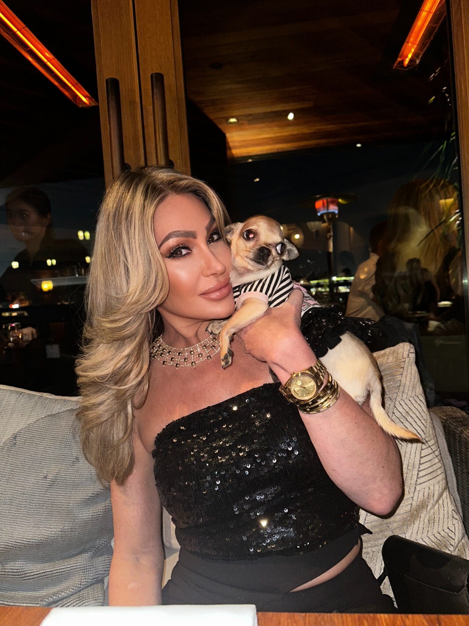 Dr. Sydney Ceruto 38 Dr. Sydney Ceruto with her dog Lola at dinner, showing authentic personal connection and loved ones in her life outside of coaching