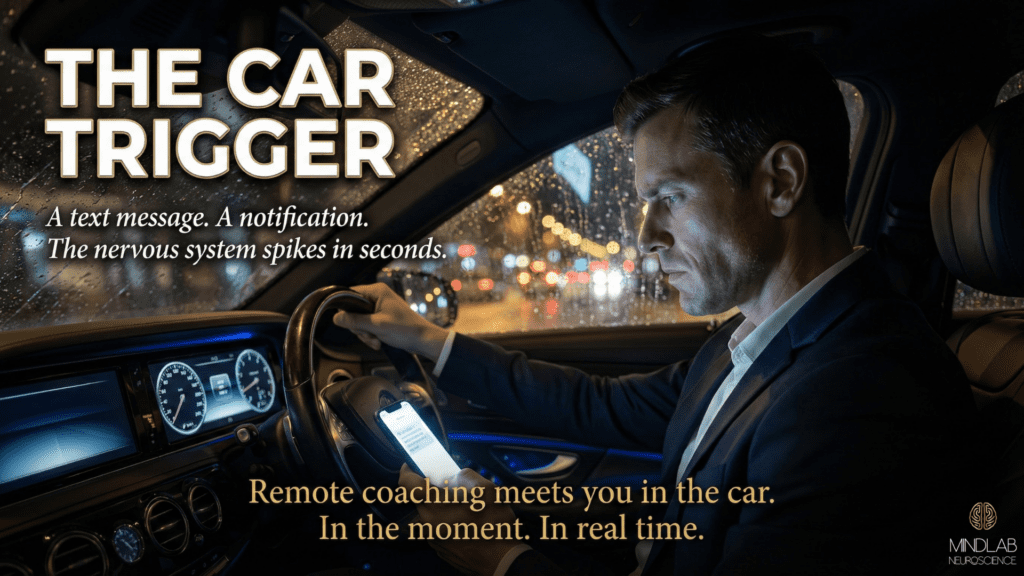 Man in luxury car at night receiving disruptive text message with phone screen illuminating face, showing real-world trigger moment remote neuroscience coaching addresses.